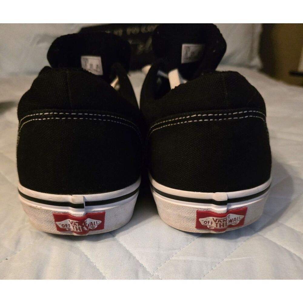 These are black Vans Authentic sneakers with white laces. - Picture 2 of 9